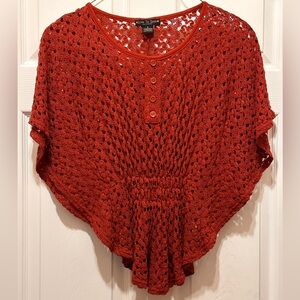 Orange net shirt. Size medium.